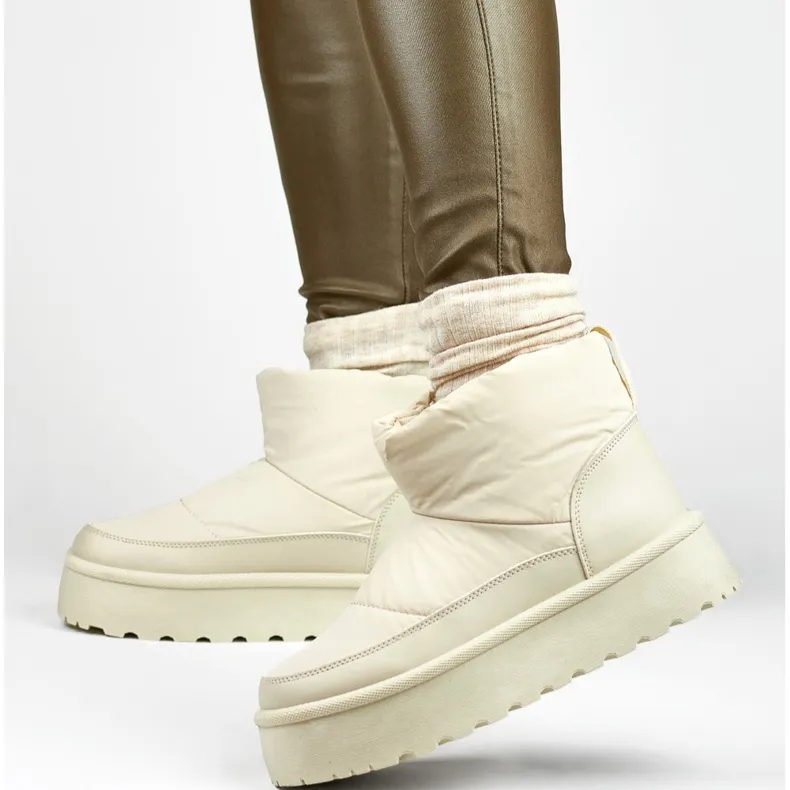 Beige women's winter snow boots with a platform