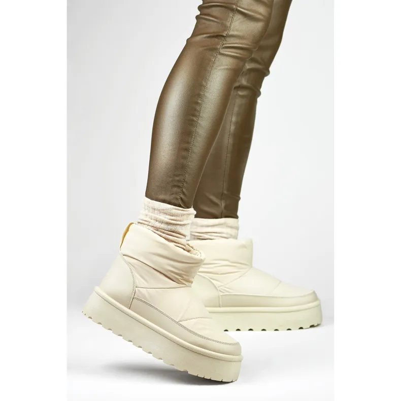 Beige women's winter snow boots with a platform